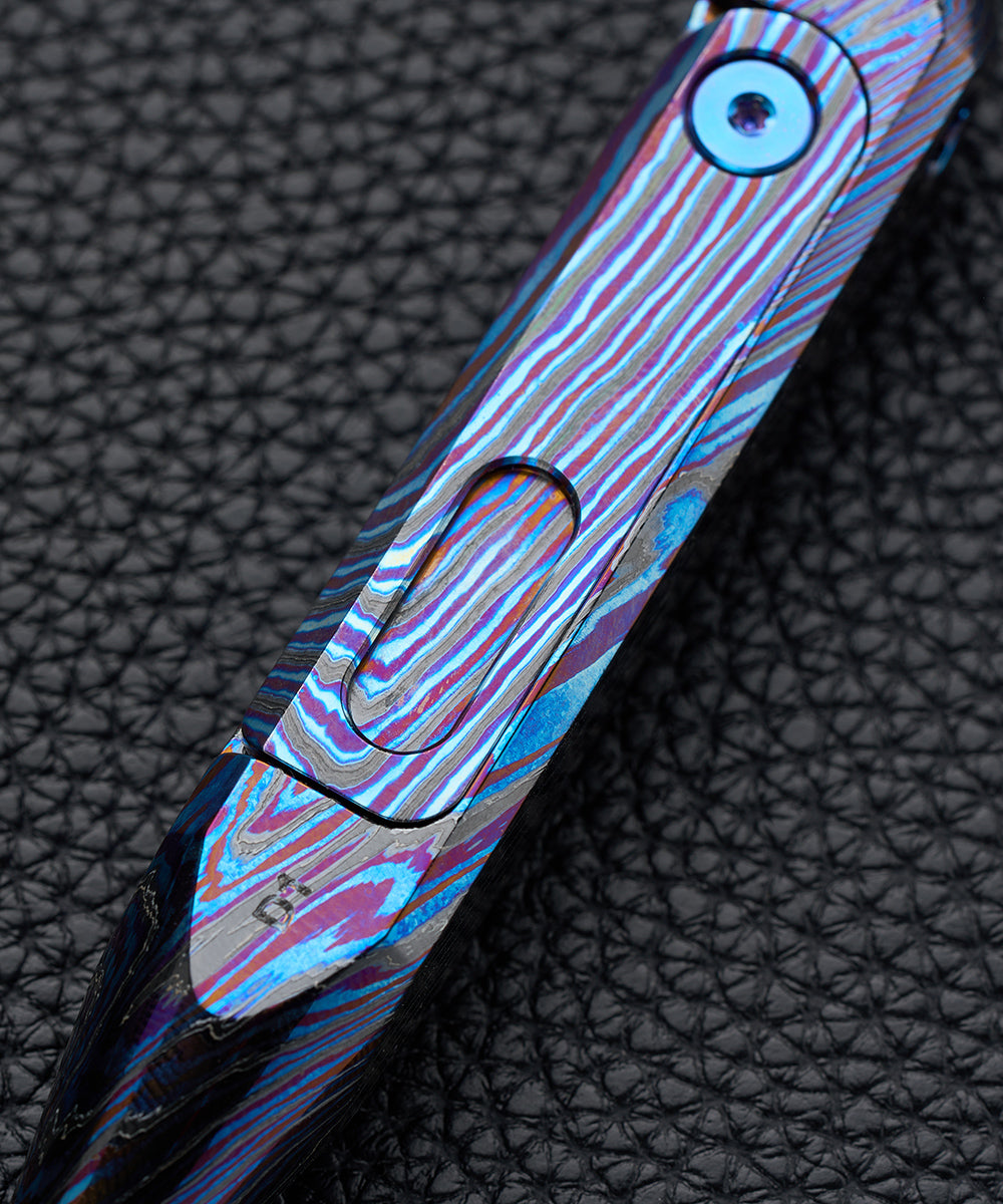 Close-up of the layered zirconium damascus pattern on the D1 screwdriver
